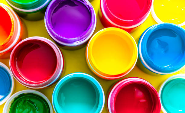 istock Multicolored paints in top view in cans 1258089665