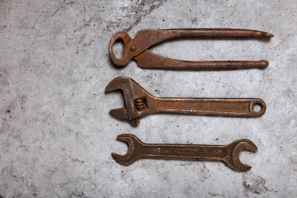 istock Tongs, wrenches and adjustable wrenches on gray concrete background 1258090857