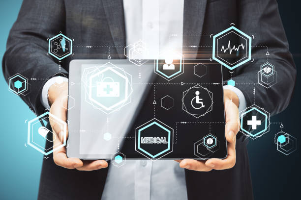 istock Businessman holding digital tablet with glowing medical interface hud hologram 1258091679
