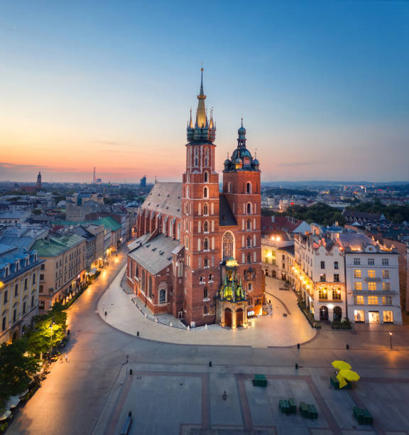 Aerial view of  St. Mary's Basilica in Krakow, Poland Krakow, Poland. Aerial view of illuminated St. Mary's Basilica (Bazylika Mariacka) on sunrise krakow photos stock pictures, royalty-free photos & images