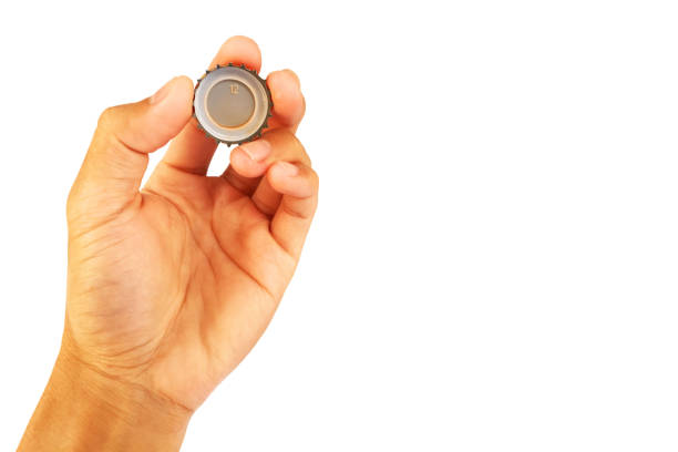 hand and verb See the soft drink cap in hand isolated on white background verb stock pictures, royalty-free photos & images