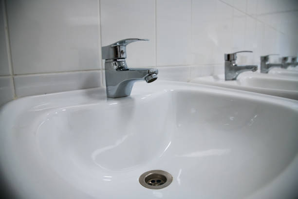 istock Close-up of row modern ceramic wash hand basins 1258094877