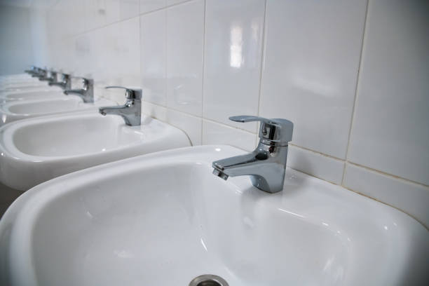 istock Close-up of row modern ceramic wash hand basins 1258094899
