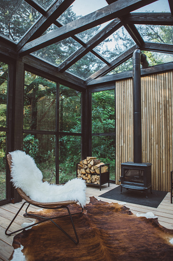 Comfortable arranged greenhouse with fireplace