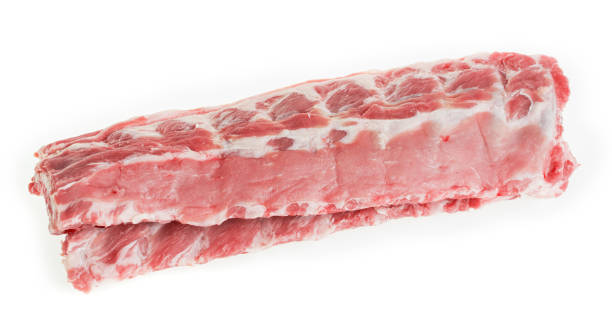 two raw pork ribs on a white background, isolate. - sparerib imagens e fotografias de stock