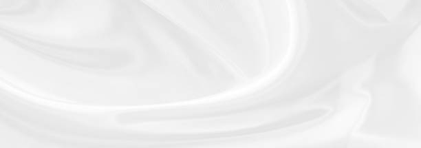 istock White gray satin texture that is white silver fabric silk panoramic background with beautiful soft blur pattern natural. 1258101811