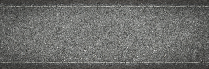 Surface of new clean cracked asphalt. Tarmac grey grainy road texture or background. Top view.