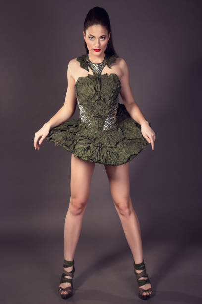 istock Fashionable beautiful brunette woman posing in studio. 1258110846