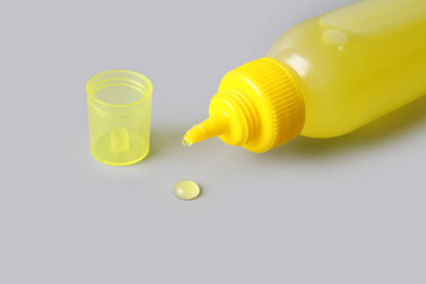 istock Glue bottle isolated on gray background 1258111512