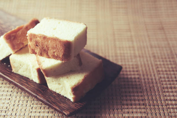 istock Home made fresh sponge sliced cakes on wooden tray 1258112203