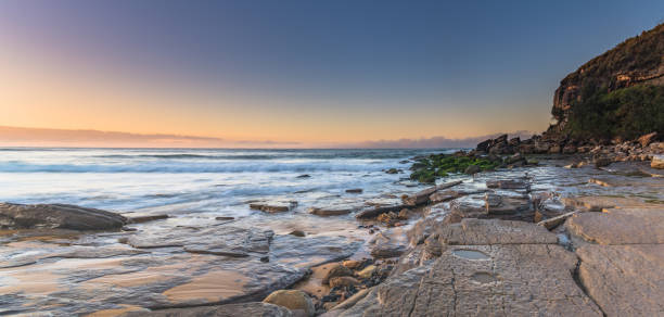 istock Clear skies winter sunrise seascape panorama 1258113577