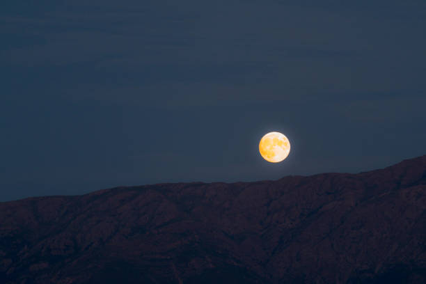 istock Red moon raise in corsica mountains 1258113588