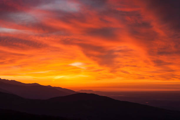 istock It dawns over the mountains and the sun illuminates the clouds 1258113908