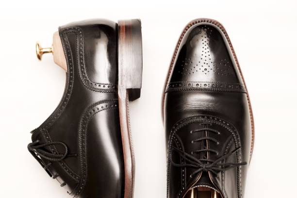 istock Black leather shoes on white background. 1258114862