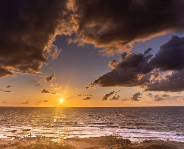 istock Sunset clouds on sea beach of romantic vacation 1258114990