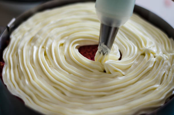 istock Red velvet cake in the process of preparation 1258121590