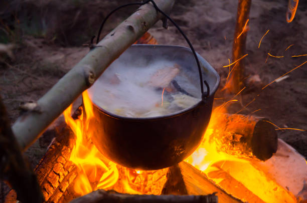 istock camping cauldron. cauldron at the stake. rest by the river 1258124879