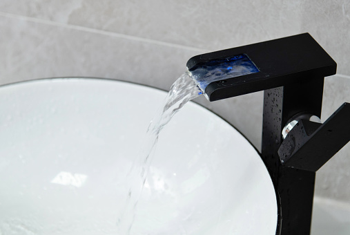 sink faucet with water is a symbol of life, purity, and renewal. It represents the essential element of water as a source of nourishment, refreshment, and cleansing