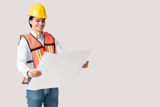 istock Smiling Civil Engineer Examining Blueprint 1258125452
