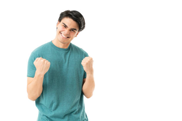 istock Happy Hispanic Man Celebrating Victory 1258126392