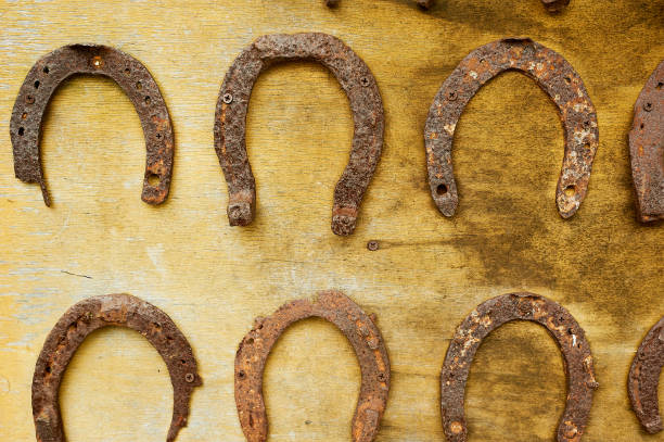 istock Old rusty forss on a wooden surface. Forging, blacksmithing.Texture 1258127419