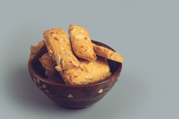 istock Home made sweet biscuits with mixed nuts in wooden bowl 1258131978