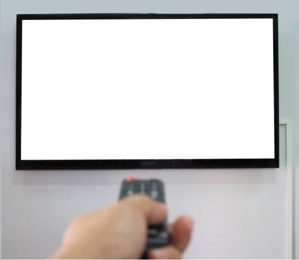 istock Empty TV screen  and the hand is holding the remote control to change the channel. 1258132281