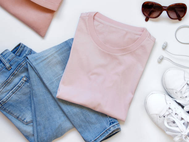 istock Mockup of a folded t-shirt placed surrounded by trendy aaccessories 1258133111