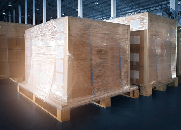 istock Stacked of shipment boxes wrapping palstic on pallet in warehouse storage. Cargo export & Shipping warehouse, Logistics and transportation. 1258133231