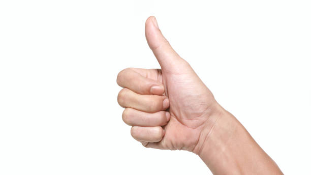 istock Close up male thumb up isolated white background. 1258134165