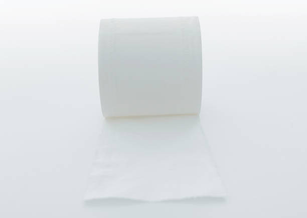 istock Roll of white toilet paper on white background 1258134395