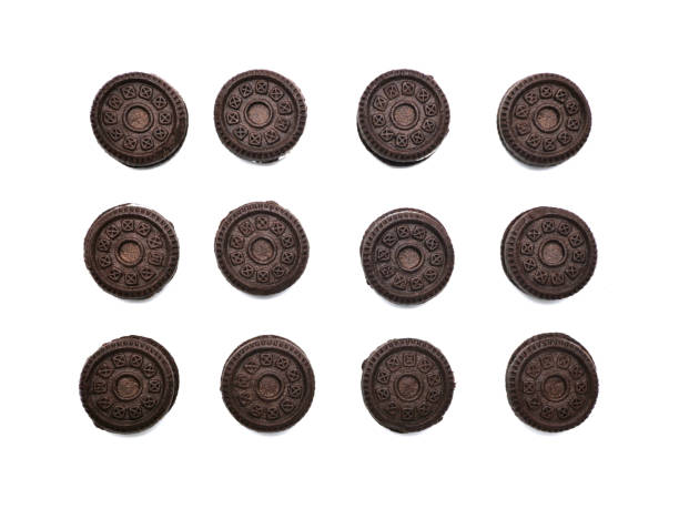 istock Sandwich chocolate cookies filled with a vanilla cream flavour biscuits isolated on white background. 1258134428