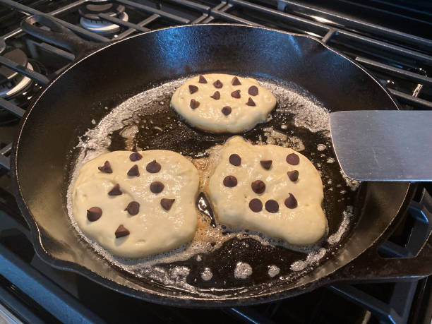 istock Chocolate Chip Pancakes Cooking in Cast Iron Skillet 1258136920