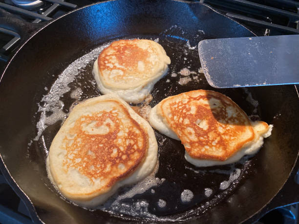 istock Pancakes Cooking in Cast Iron Skillet 1258137011