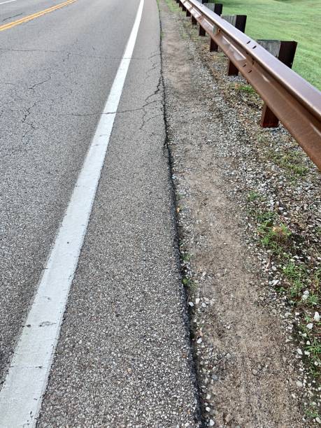 istock Walking Path and Berm of Road Guardrail 1258137602
