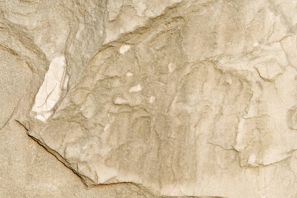 istock Yellow rough marble stone texture closeup 1258137774