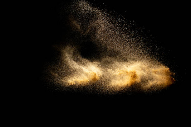 istock Abstract cloud motion blurred sand background.Sandy explosion isolated on over dark background. 1258139167