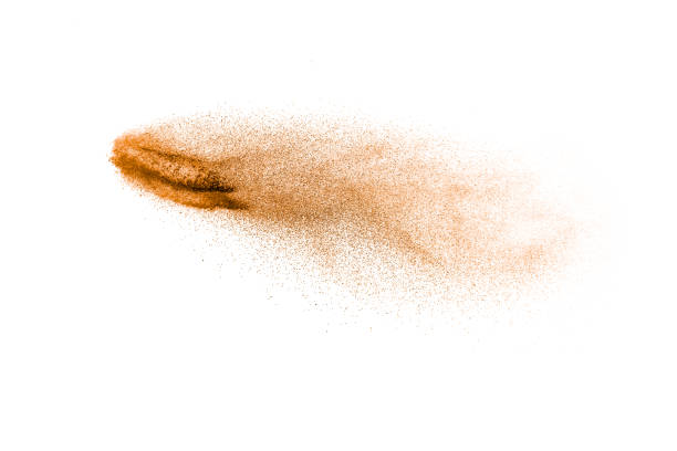 istock Brown dry river sand explosion isolated on white background. Abstract sand splashing. 1258139168