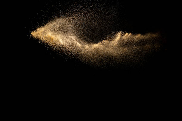 istock Abstract cloud motion blurred sand background.Sandy explosion isolated on over dark background. 1258139169