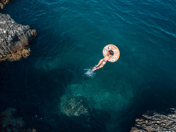istock Woman splashing water in summer 1258139200