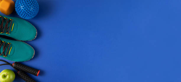 istock Sport Equipment and Accessories on Blue Background 1258141506