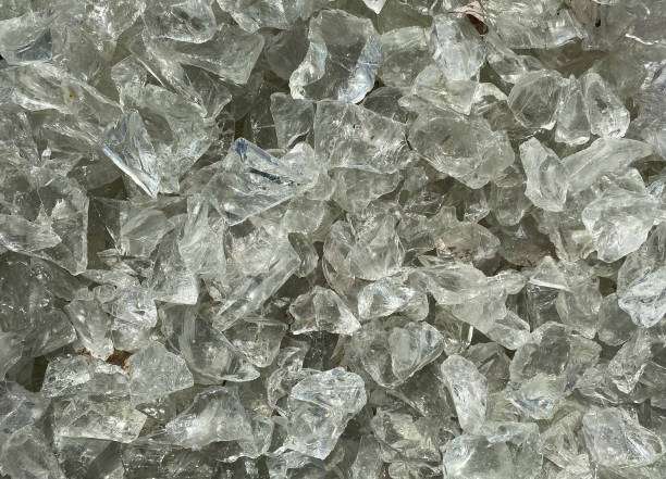 istock Closeup of isolated grey and white rough glas shards 1258142517