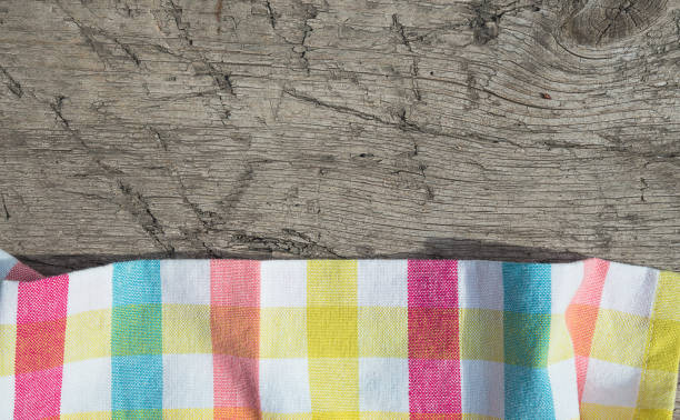 istock Checkered napkin on rustic non paint wooden background. Space for text 1258144099