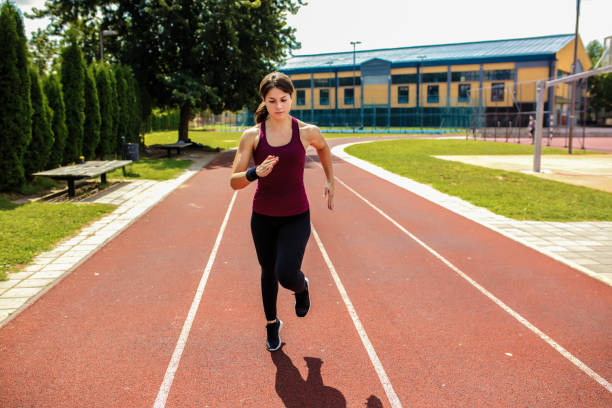 istock Female race runner on a racing track 1258148615