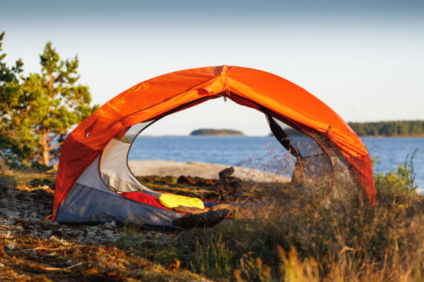 istock Orange tent on the island close-up. 1258148677