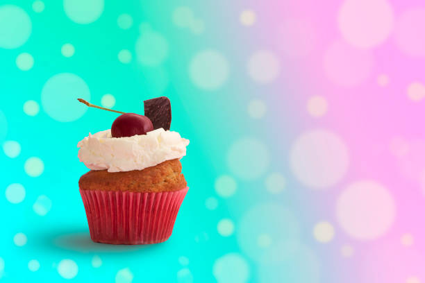 Delicious cupcake with colorful blurred lights background with space for text