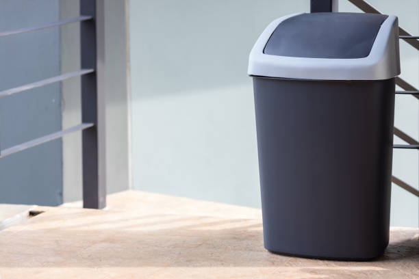 istock A black bin at home. black trash can. Garbage trash bin. 1258156179