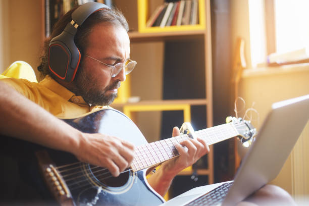 istock a man is taking music recording in his room 1258157641