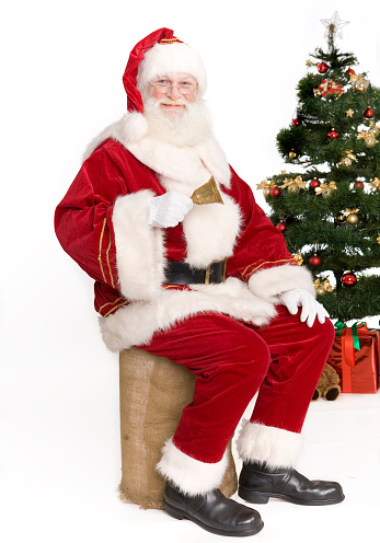 Traditional Christmas Santa Claus and Christmas tree isolated on white.Santa Claus with Clipping path