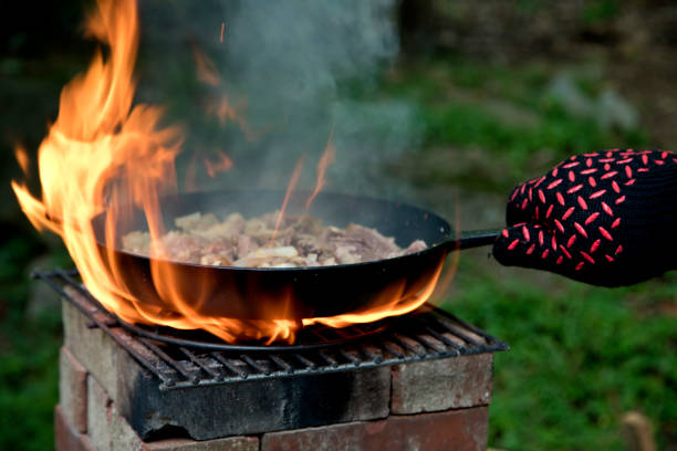 Cooking food on a stove made of bricks.